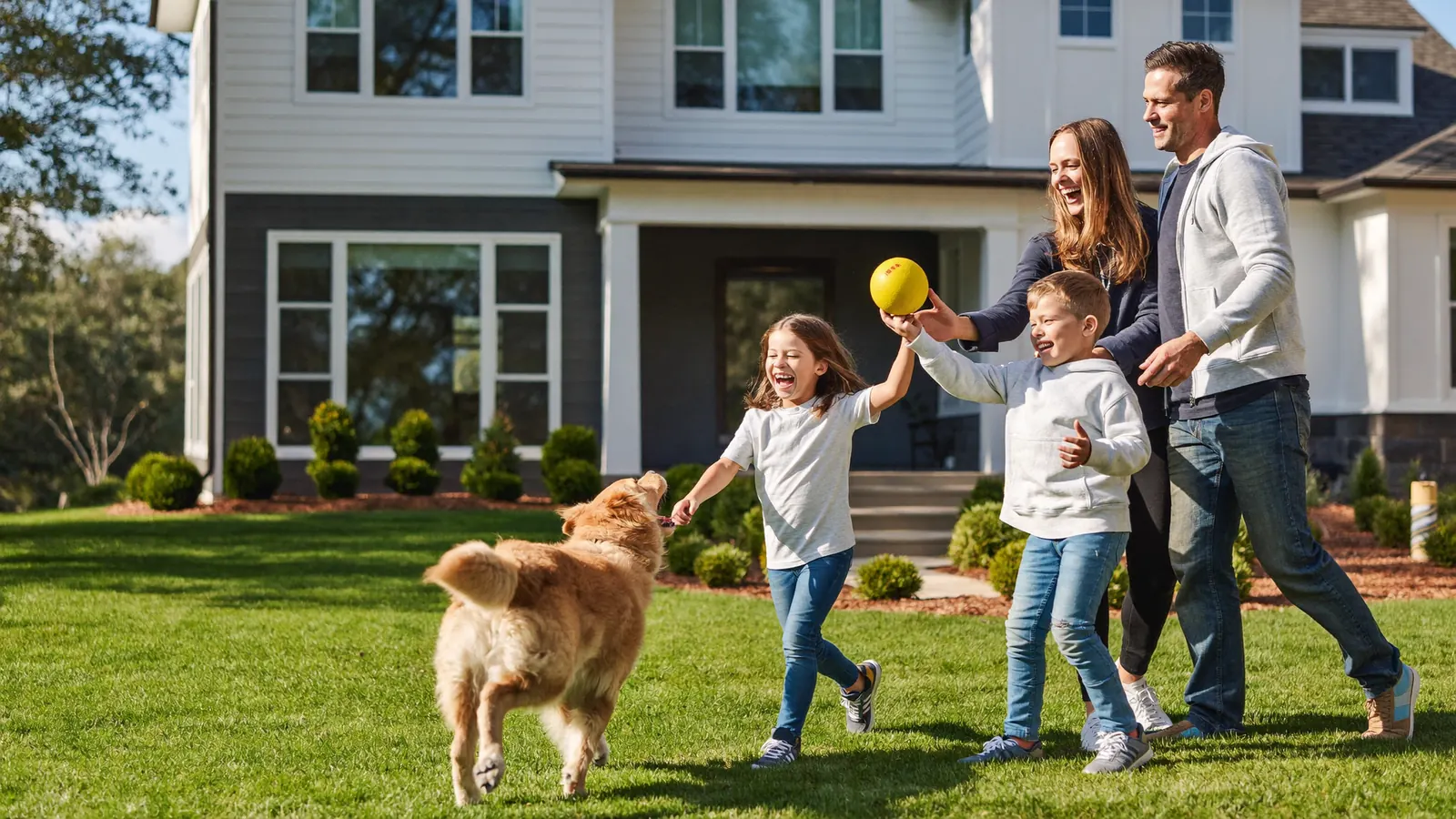 A California family and their dog playing in the front yard of the home whose equity they accessed with no monthly payments
